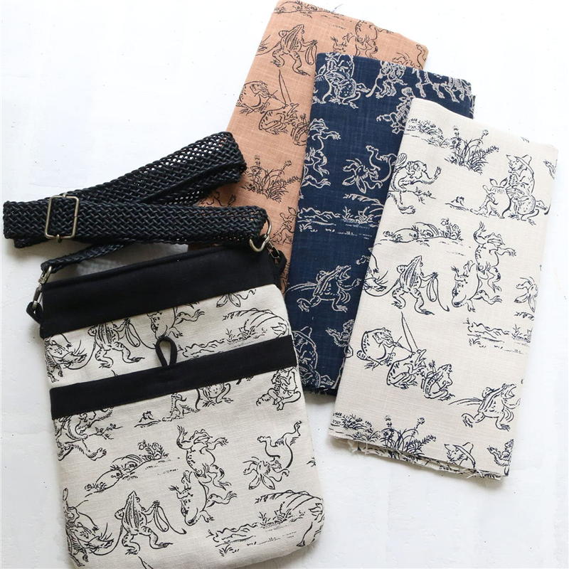 日本紐釦貿易 鳥獣戯画 むら糸藍染調 プリント生地 カラシ×黒線 巾約110cm 2mカット KW7070-7J-2M 1枚（ご注文単位1枚）【直送品】