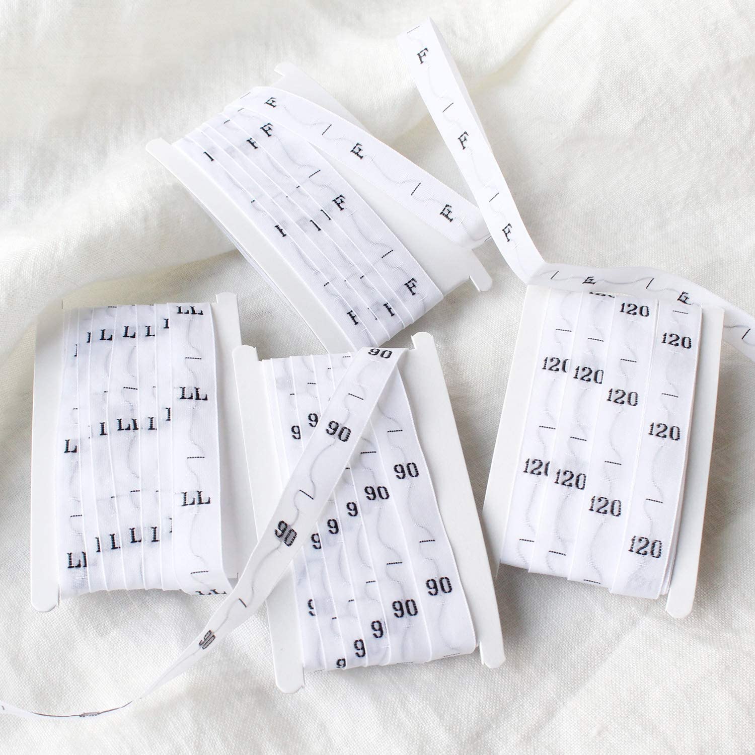 日本紐釦貿易 サイズタグ 140 9mm巾 白 徳用1000枚分 TME-140-1000 (ご注文単位1束)【直送品】